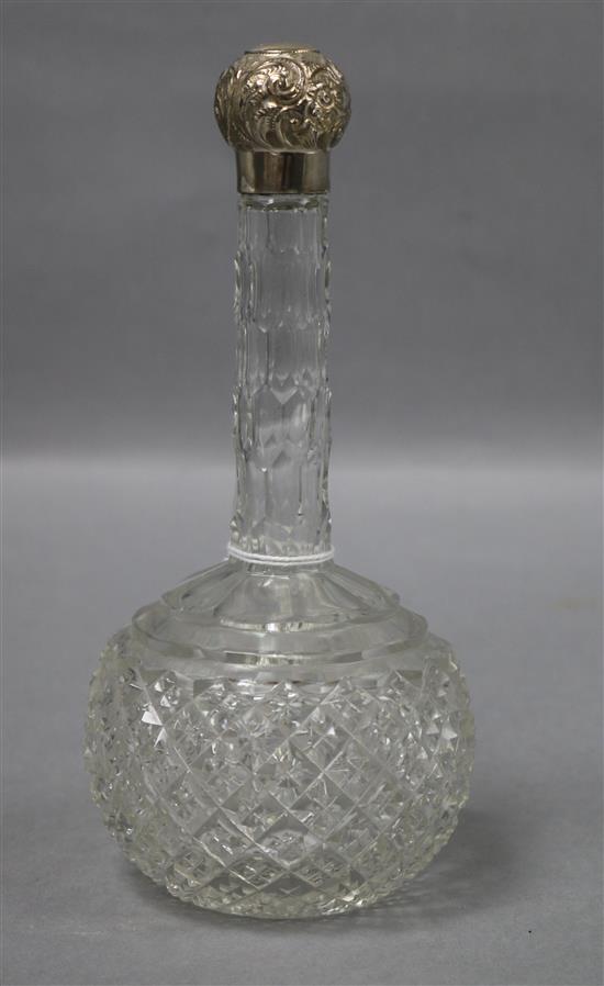 An early 20th century silver topped long necked cut glass globular scent bottle, Miller Bros. Birmingham, circe 1905,